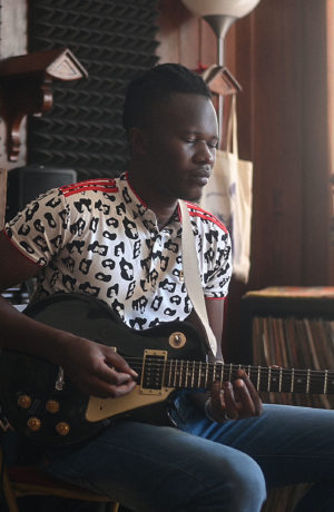 Salif Koné playing guitar